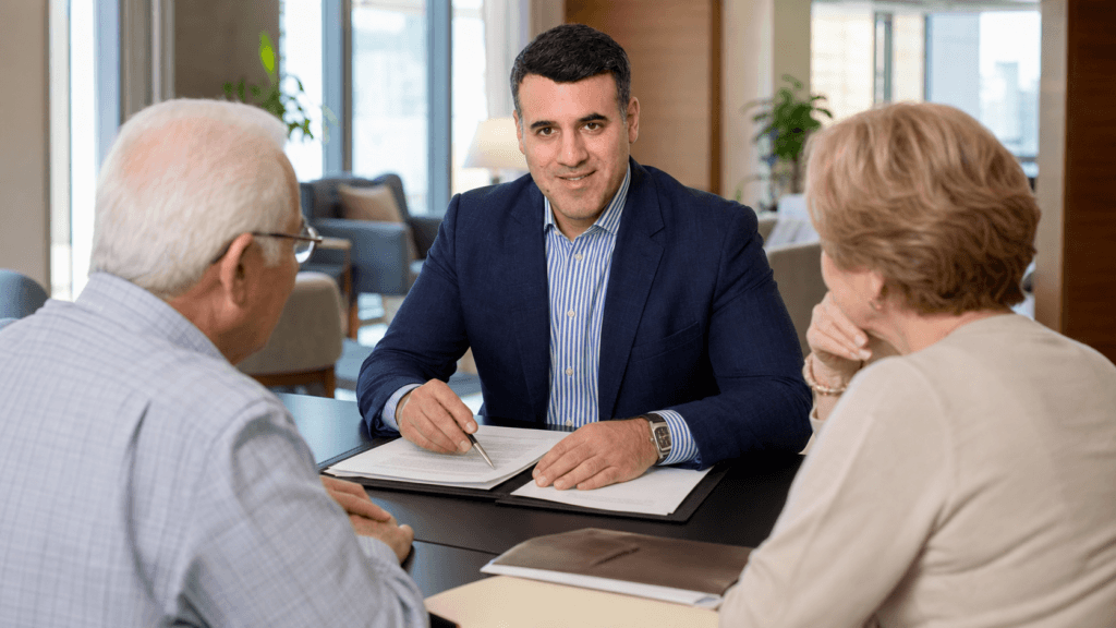 Attorney Asaf Arazi-Biton reviewing an assisted living agreement with an older couple