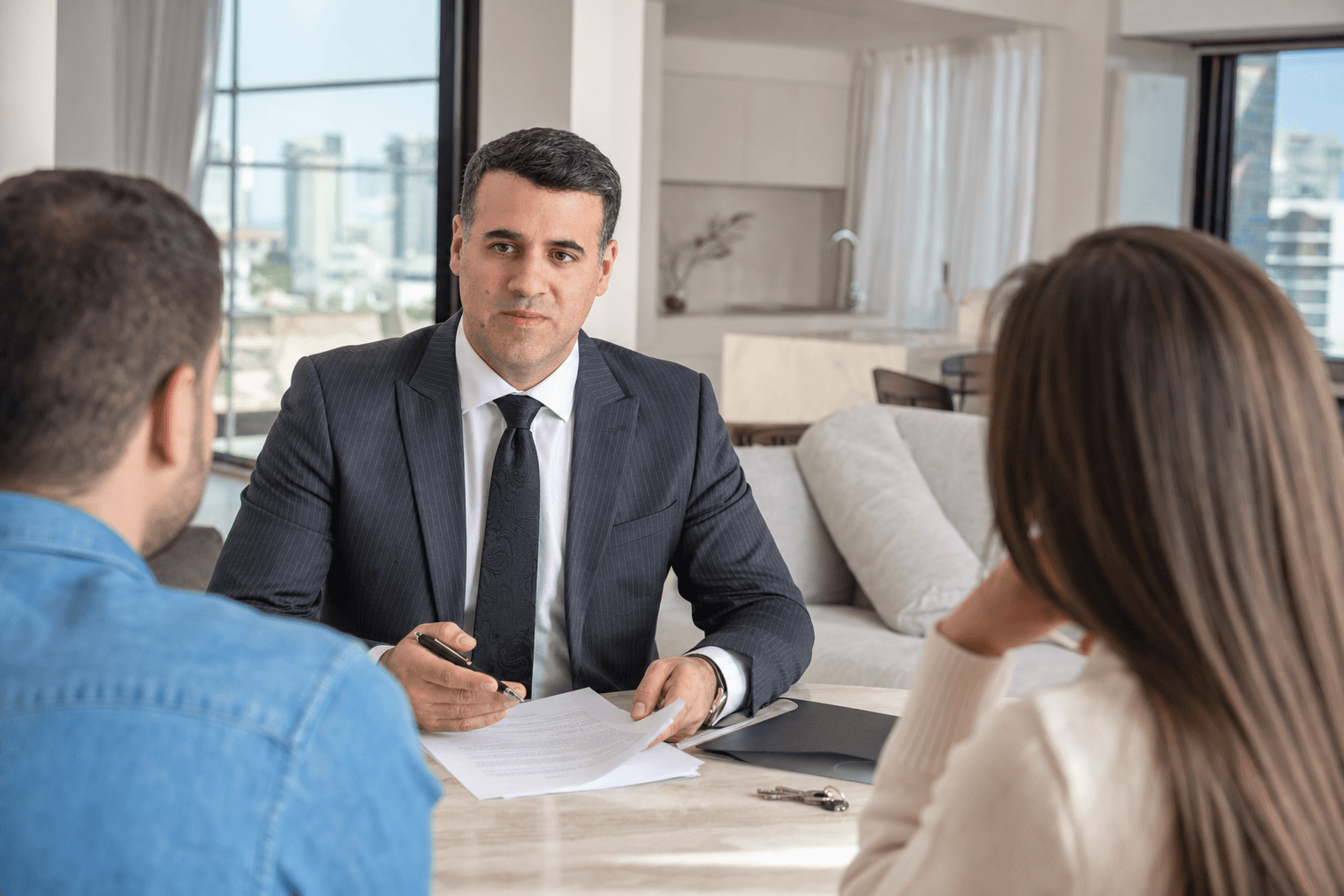 Asaf Arazi-Biton advising buyers during a second-hand apartment purchase