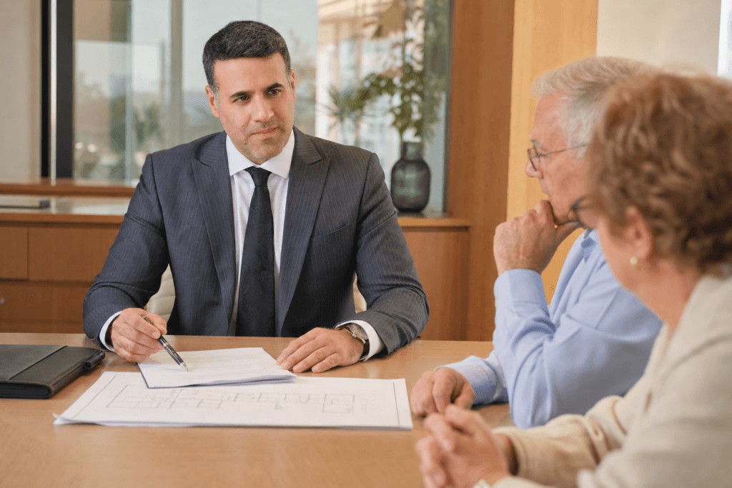 Asaf Arazi-Biton advising an older couple on estate planning, enduring power of attorney and real estate assets