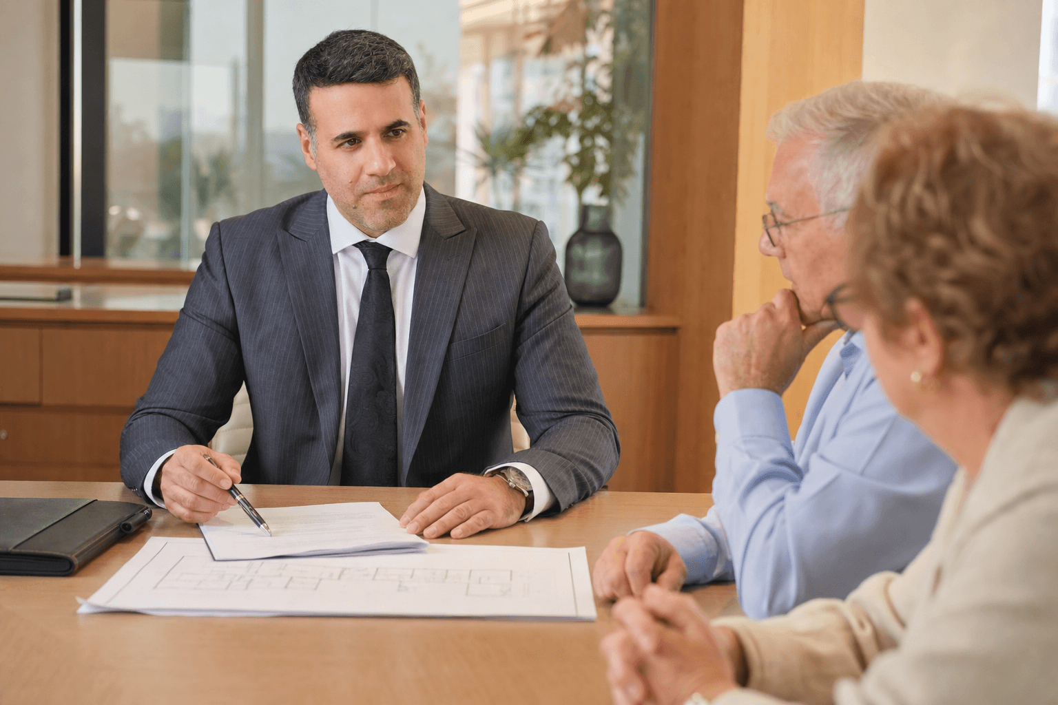 Asaf Arazi-Biton advising an older couple on estate planning, enduring power of attorney and real estate assets