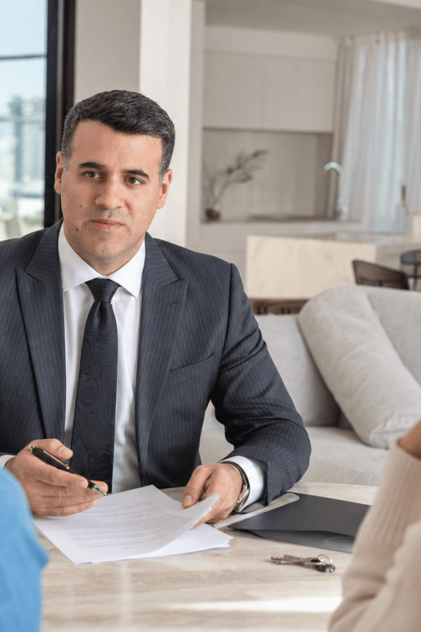 Asaf Arazi-Biton advising buyers during a second-hand apartment purchase