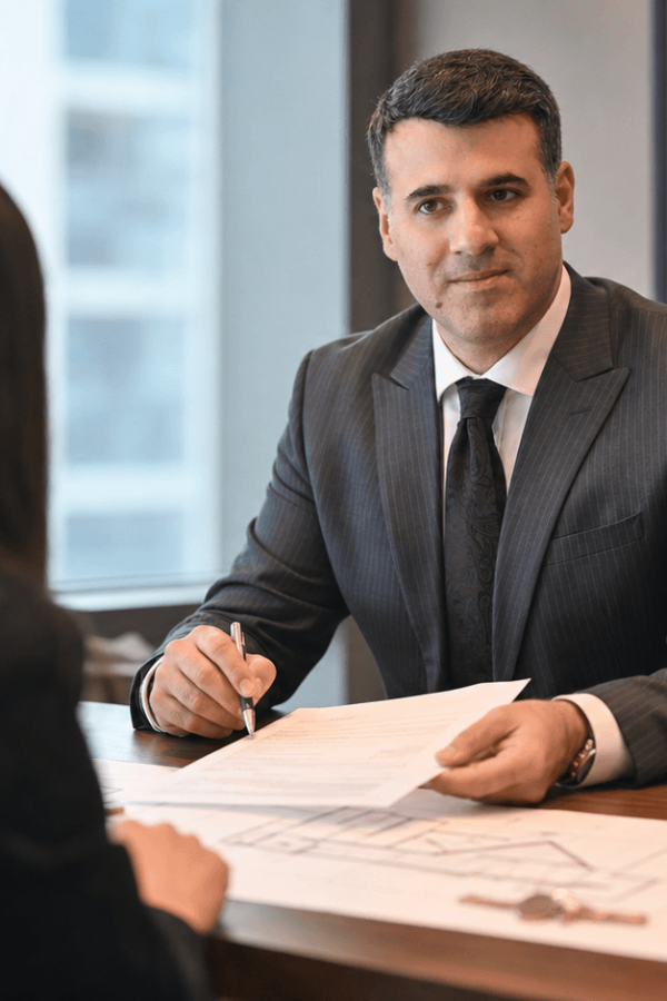 Asaf Arazi-Biton advising clients about selling a mortgaged apartment in Israel